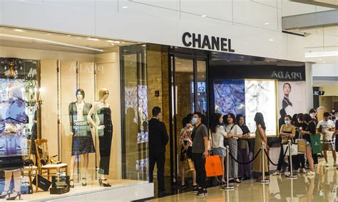 chanel to 'shed jobs' as china luxury goods market slumps